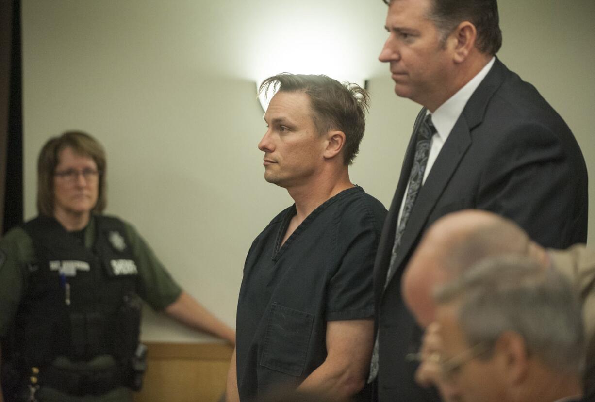 Evergreen High School science teacher Matthew Morasch, 40, makes a first appearance June 23 in Clark County Superior Court. He was arraigned Wednesday on two counts of voyeurism and entered not-guilty pleas to the counts.