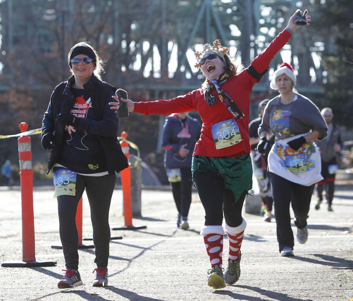 Participants of the fifth-annual Hot Buttered Run work off their Thanksgiving meal calories Sunday morning.