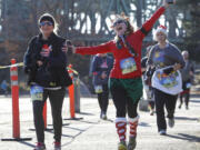 Participants of the fifth-annual Hot Buttered Run work off their Thanksgiving meal calories Sunday morning.