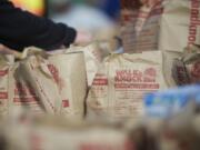 Volunteers unload, organize and reload food donations at Alki Middle School during the annual Walk