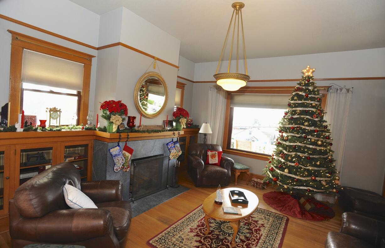 Mike and Michelle Hughes, the new owners of the historic Farrell House, have decorated their living room in preparation for the Downtown Camas Association's Holiday Home Tour on Saturday and Sunday.