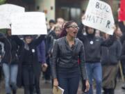 Student Cetara Davis leads a march held in response to the fatal police shooting of an unarmed black teen in Ferguson, Mo., and other similar cases around the nation on Wednesday at the Washington State Vancouver campus.