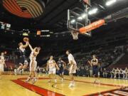 The Skyview boys basketball team take on Prairie in front of a few hundred fans at the Rose Garden in Portland on Monday.