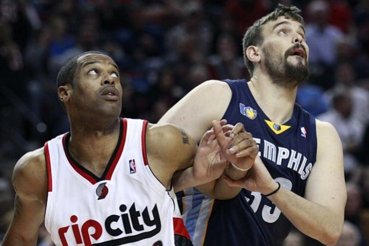 Portland Trail Blazers' Marcus Camby (23) and Memphis Grizzlies' Marc Gasol (33) work for position under the boards.