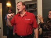 Steve Dipaola for The Columbian
Democrat Craig Pridemore and supporters react to early election results at the Grant House. After the first returns, Pridemore has a small lead over Republican Jeanne Stewart.