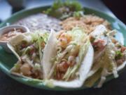 Fish tacos with shrimp substituted for the fish are served at 2 Margaritas Grill in Vancouver.