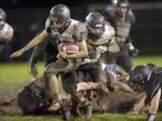 Hockinson's Tommy Harshaw breaks through and runs for a 67-yard touchdown to give the Hawks a 14-0 lead in the third quarter of their 14-7 road victory over Woodland.