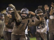 &quot;Muddy Celebration&quot; by Columbian photographer Steven Lane placed third in the Sports Photography category.