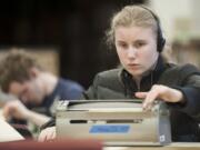 Tenth-grader Tabitha Smith works on her Perkins Brailler, a standard six-key typewriter for braille.