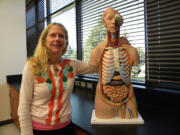 Susie Ridgway uses the skinless &quot;Skynyrd&quot; to teach about the muscular system in her Henrietta Lacks Health and Bioscience High School classroom. She spent a week at the Centers for Disease Control and Prevention in Atlanta learning about epidemiology and public health.