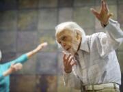 Harris Dusenbery, 100, takes part in an exercise class at his condo with other Heritage Place residents.