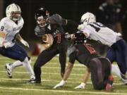 Camas quarterback Liam Fitzgerald (7) is taken down by the Bellarmine Prep defense Saturday in the Papermakers' loss in the opening round of the Class 4A football state playoffs.