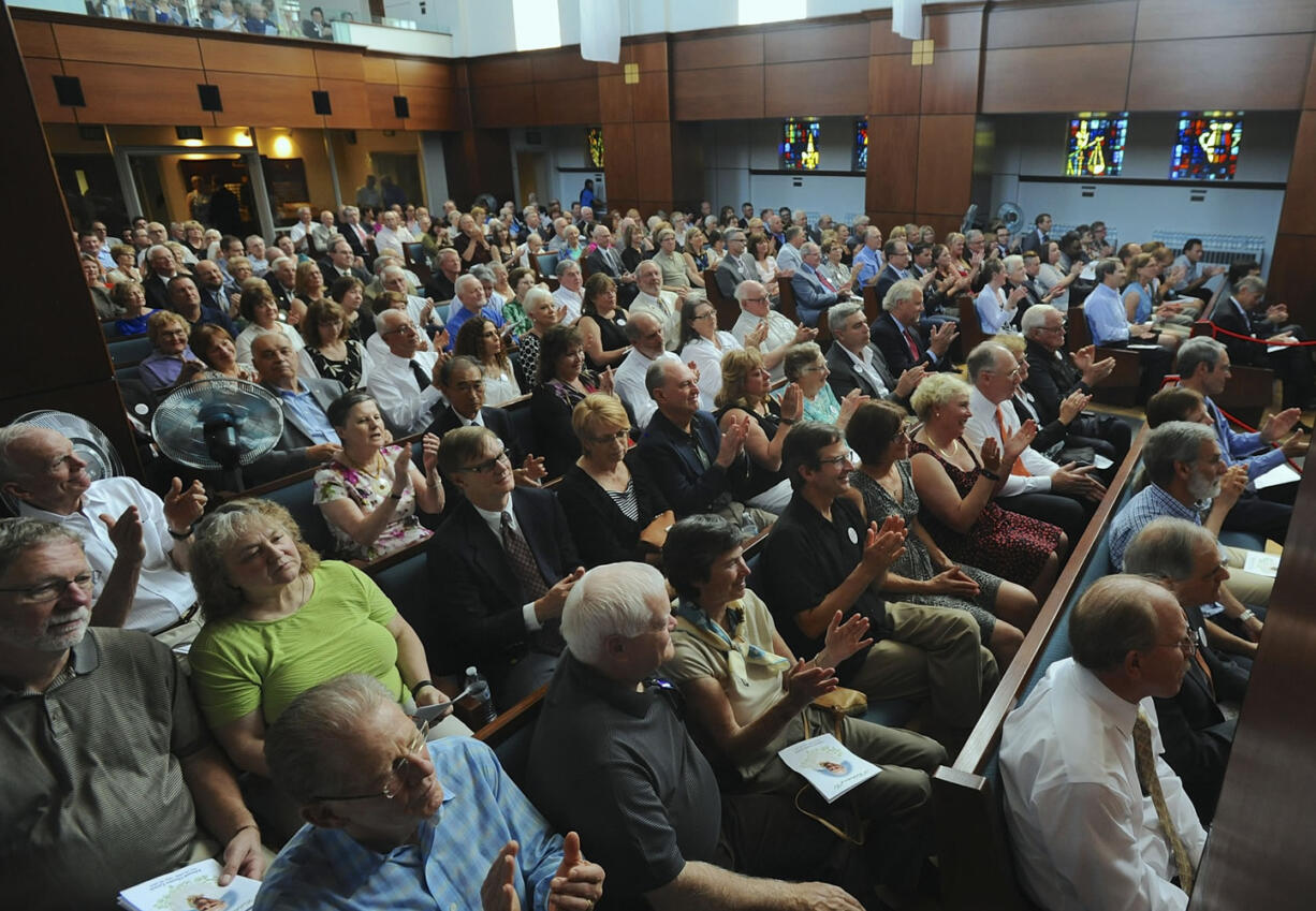 Hundreds of people packed into the sanctuary and nearby overflow rooms Sunday at First United Methodist Church to celebrate the life of philanthropist Ed Lynch.