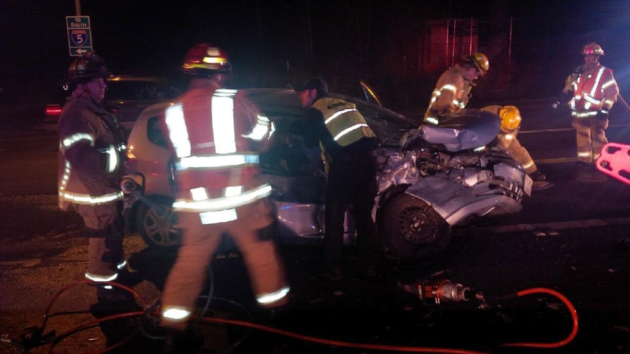 A car merging onto Interstate 5 from state Highway 502 was struck by a pickup Thursday evening.