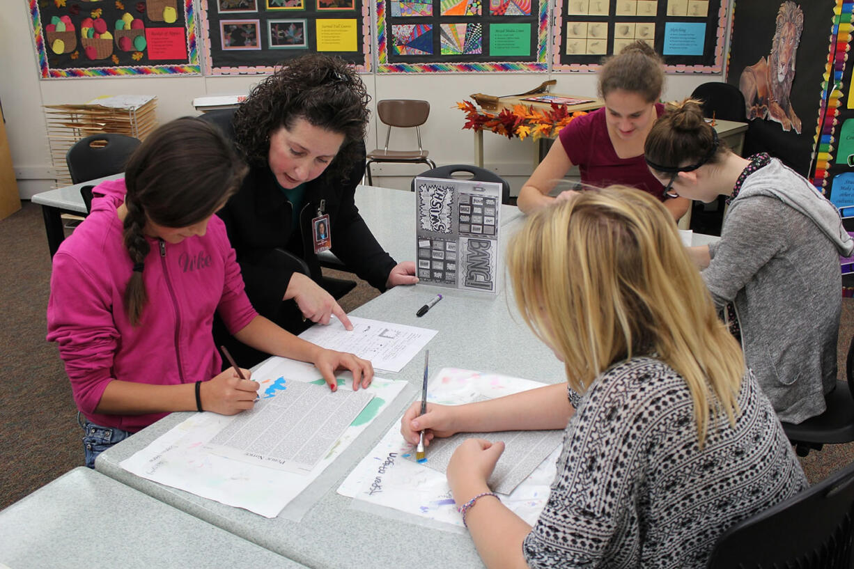 Brush Prairie: Laurin Middle School art teacher Tanya Bachman, who was recently awarded &quot;Middle Level Educator of the Year&quot; from the Washington Art Education Association, helps students with an art project.