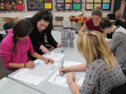 Brush Prairie: Laurin Middle School art teacher Tanya Bachman, who was recently awarded &quot;Middle Level Educator of the Year&quot; from the Washington Art Education Association, helps students with an art project.