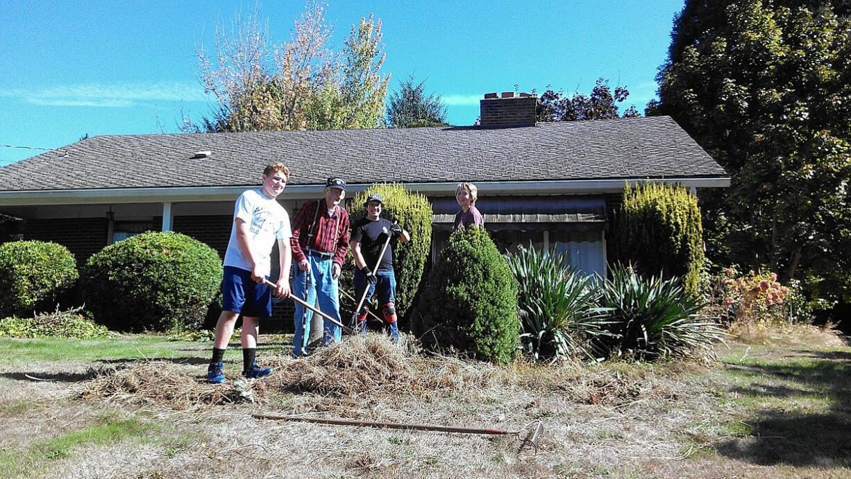 Minnehaha: Members of the Lions LEO Legends group help clean up the yard of 95-year-old Chet Plotner in the Minnehaha neighborhood during a day of service last month.