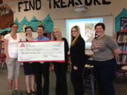 Vancouver Heights: Staff of iQ Credit Union present a $3,000 check from its iQ for Kids Foundation to Marshall Elementary.