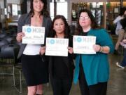 Camas: Lindsay Holmes, left, student Daniela Garcia and Michelle Bart take a stand at Hayes Freedom High School on March 6.