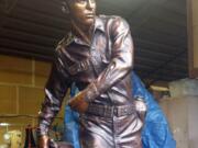 The finished bronze of World War II soldier Leonard DeWitt, created by Chad Caswell, was unveiled Sunday in downtown McMinnville, Ore.