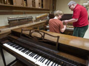 Don Mitchell works with student Stefan Kincaid, 25, of Sennett, N.Y.