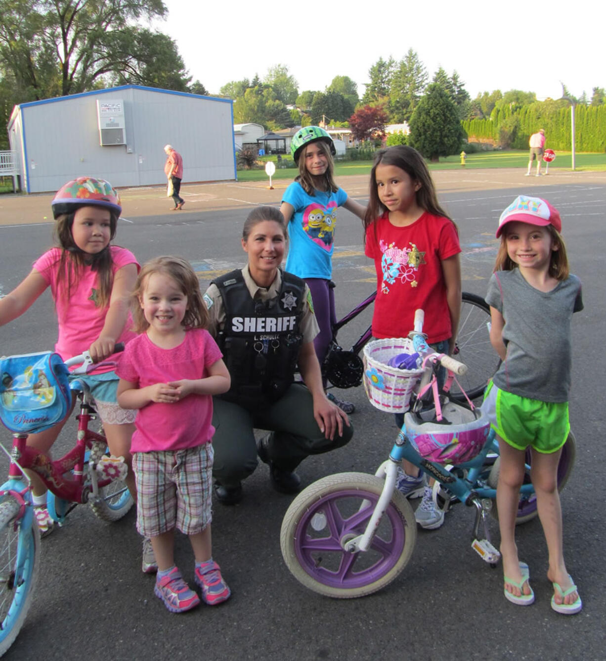 Truman: Lindsay Schultz, a Clark County Sheriff's Office deputy, with kids at a bike safety event hosted by the Harry S.