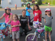 Truman: Lindsay Schultz, a Clark County Sheriff's Office deputy, with kids at a bike safety event hosted by the Harry S.