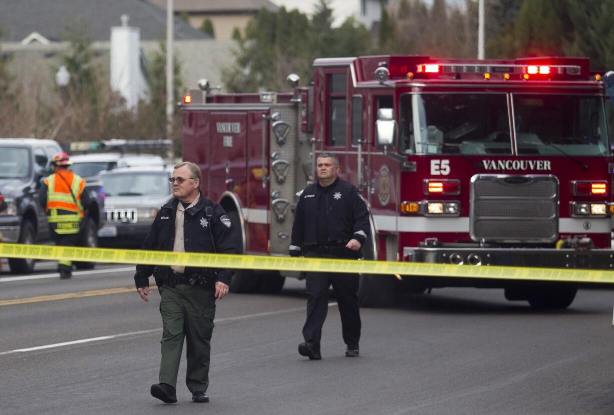 A police barricade closes off an area where a car hit a pedestrian, Anita Walters, on Monday at Northeast Andresen Road and Vancouver Mall Drive in Vancouver.