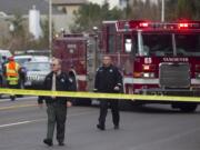 A police barricade closes off an area where a car hit a pedestrian, Anita Walters, on Monday at Northeast Andresen Road and Vancouver Mall Drive in Vancouver.