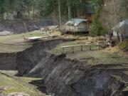 Cabins along what used to be Northwestern Lake are threatened by erosion as the White Salmon River cuts a new path to the Columbia River after Condit Dam was breached.