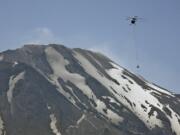 A team of USGS scientists used a helicopter to deploy their advanced &quot;spider&quot; sensors to the Mount St. Helens crater in July 2009. The spiders are designed to collect important information from dangerous situations such as volcanoes and possibly other planets.