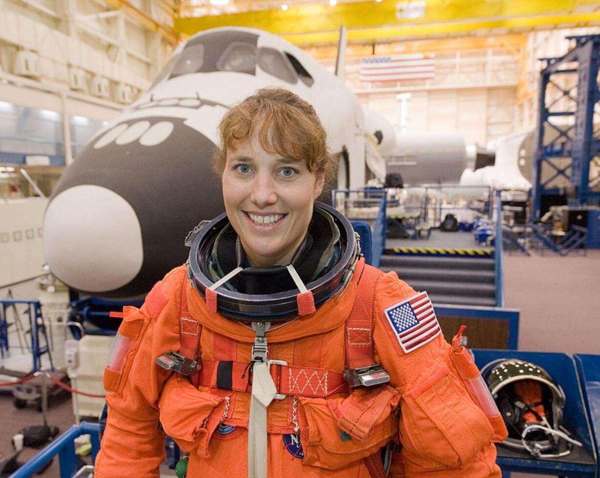 Dottie Metcalf-Lindenburger tries on a training version of the suit she'll wear for the launch.