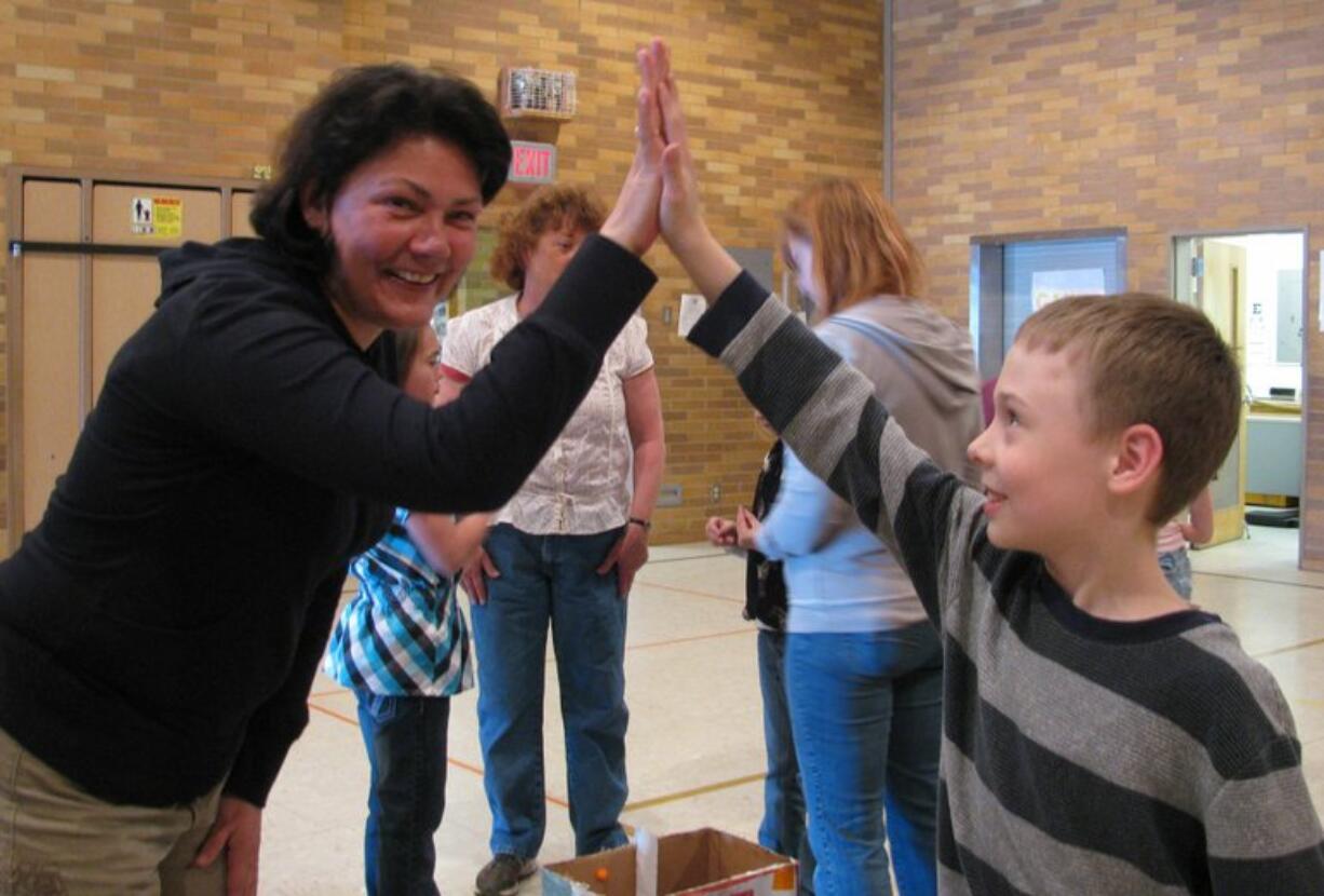 Washougal: Annie Guard, left, and Dante Grimani share a high-five.