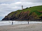 Cape Disappointment, at the mouth of the Columbia River, juts into the Pacific Ocean in this 2008 photo. New research indicates vast quantities of lava pushed out through the Columbia River basin much faster than previously understood.