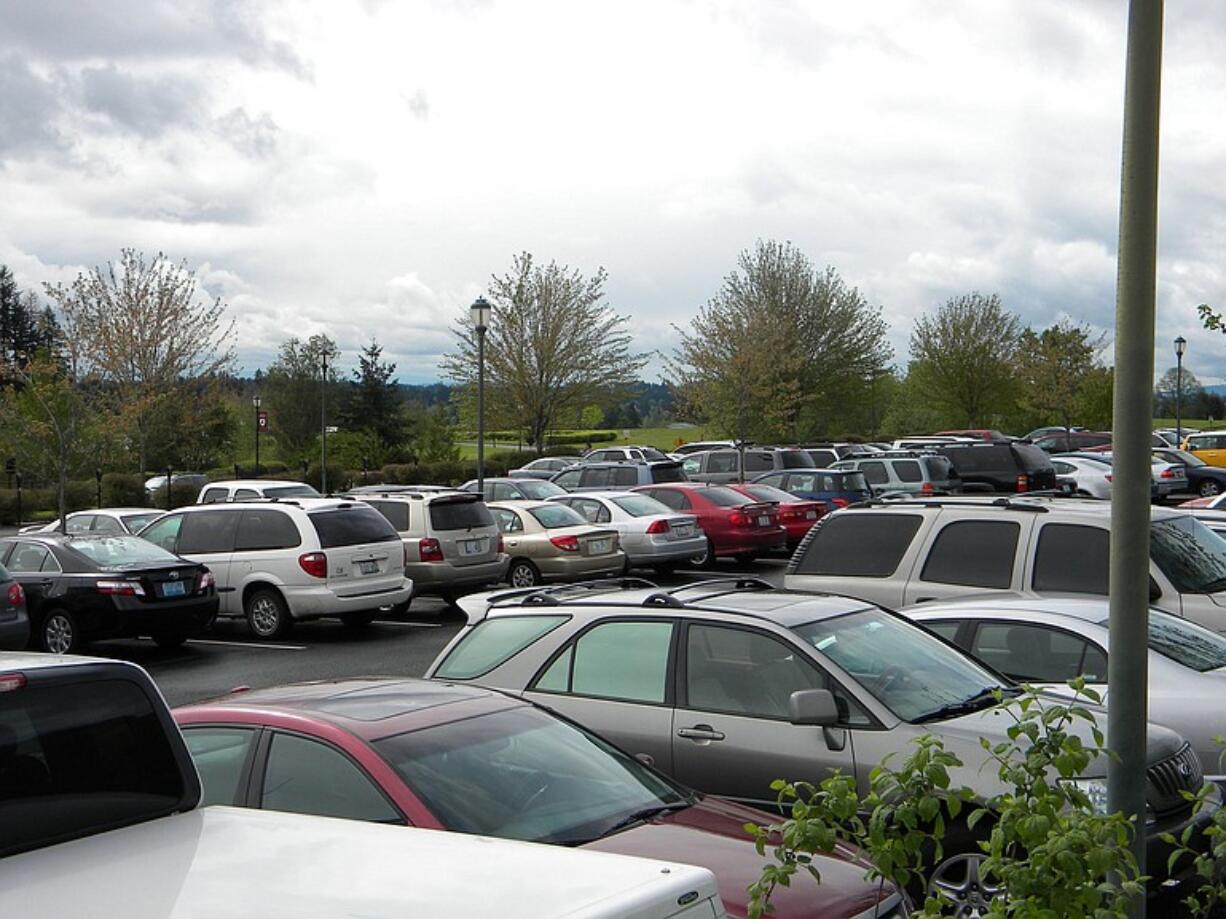 Though neighborhood parking restrictions didn't trigger an avalanche of campus parking permit sales, some students say the lots seem fuller.