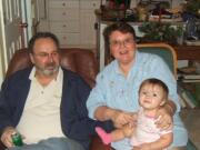 Roger, Sally and 1-year-old granddaughter Breilla Jacob, in a photo taken around Christmas 2006.