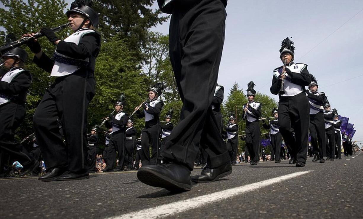 Heritage High School band members march under sunny skies before a crowd estimated at 40,000.