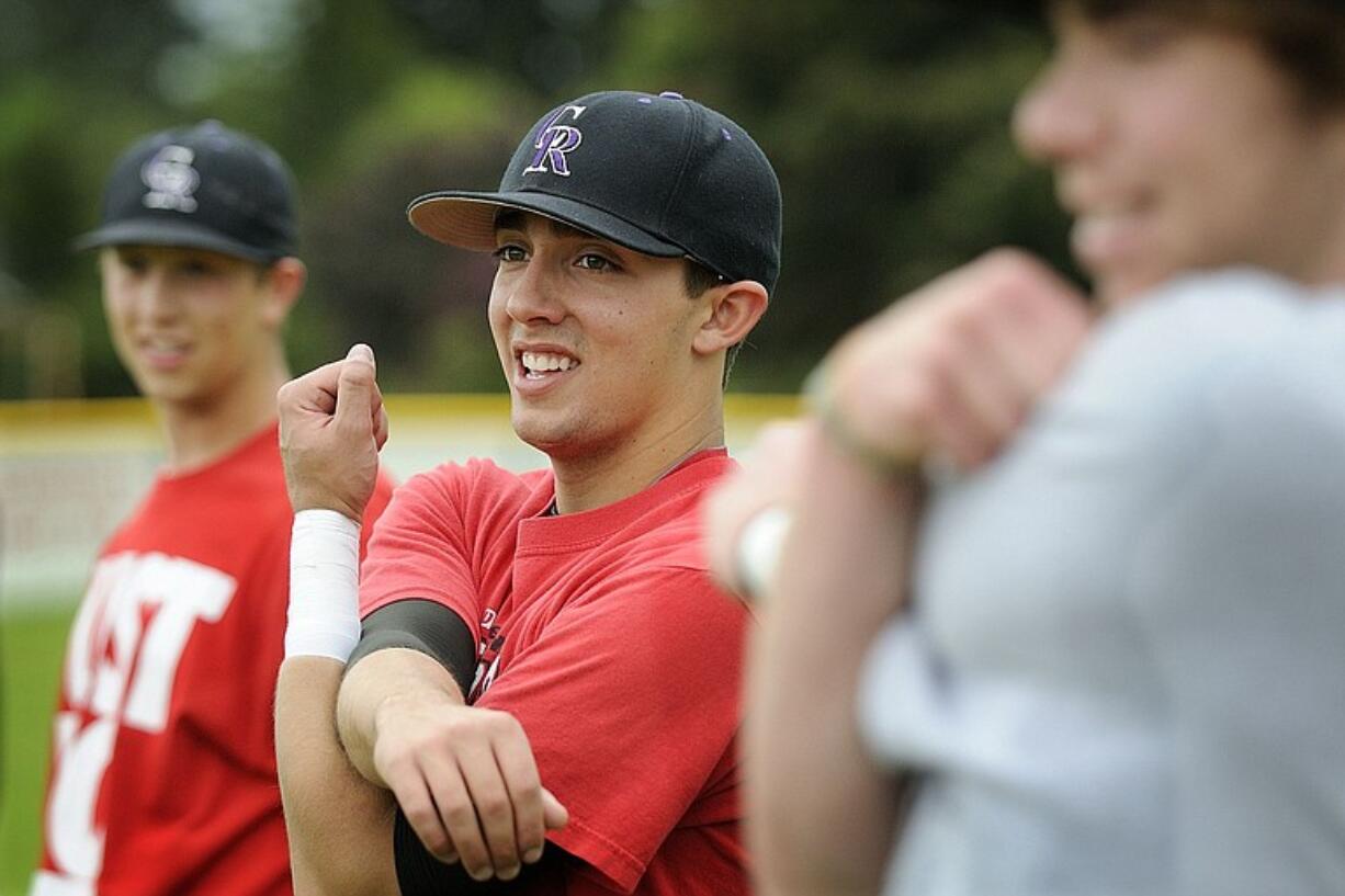 Columbia River High School first baseman David Anderson warms up at practice Tuesday as the team prepares for the state semifinals.