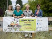 Becky Gyes, from left, Ann Foster, Anna Petruolo and Chris Bennett helped organize the new Salmon Creek Farmers' Market near Northeast 139th Street.