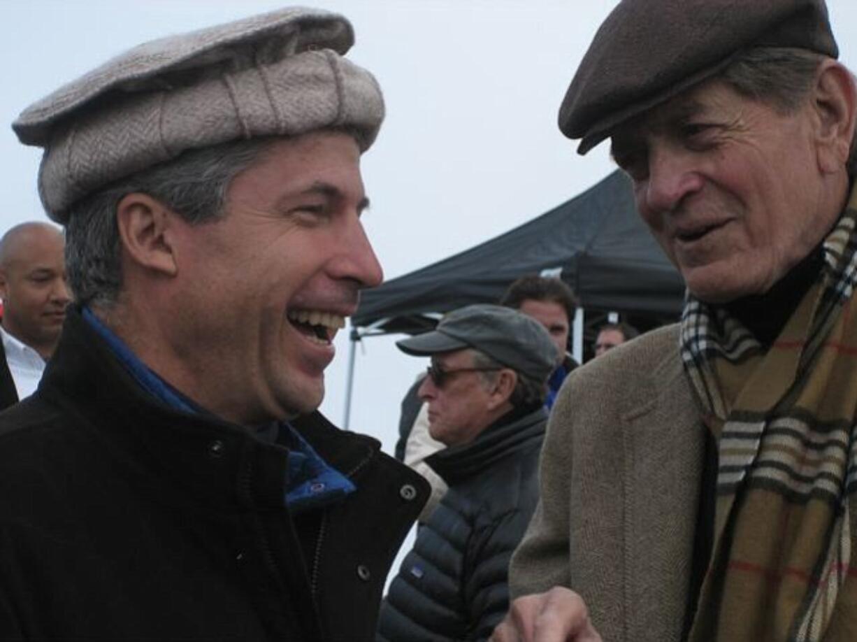 Jere Van Dyk talks with Charlie Wilson as Mike Nichols walks by in the background during filming of &quot;Charlie Wilson's War,&quot; south of Marrakech, Morocco, in 2006.