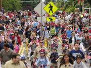 Family and neighbors walk down N.W. 36th Avenue during the annual Felida Fourth of July community parade.