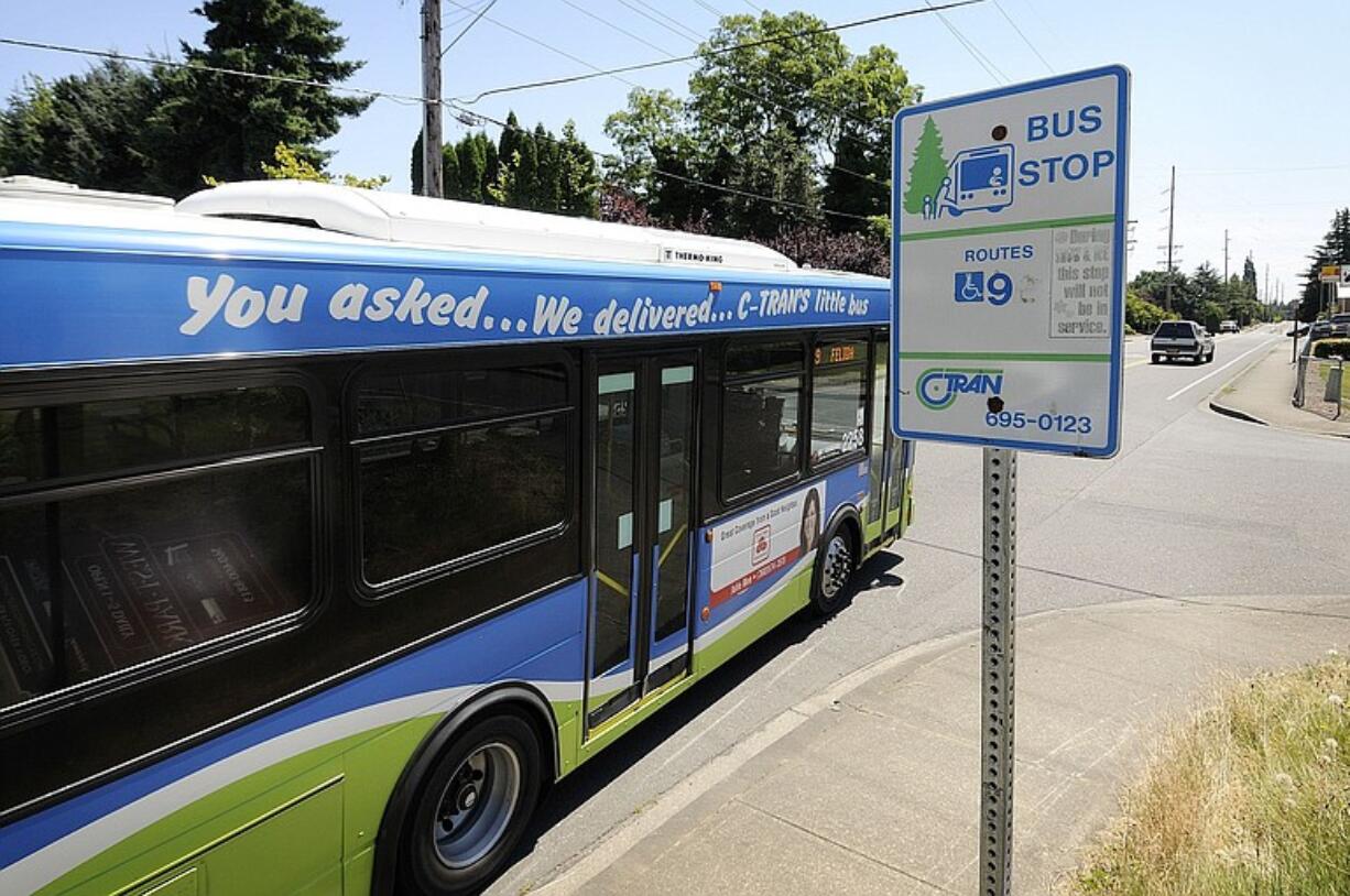 A C-Tran bus leaves a bus stop in Felida.