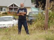 Ernie Foster, standing at the grassy swath where Northeast St. James and St.