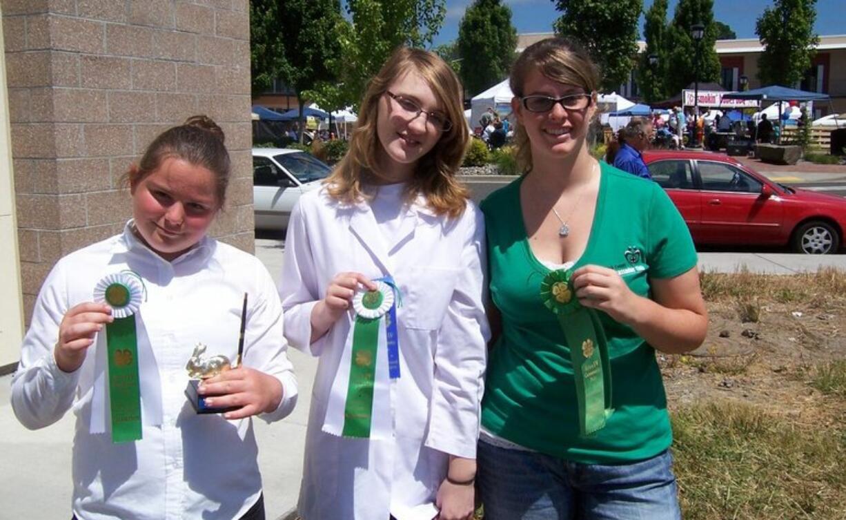 Battle Ground: Patience Owenby, from left, Lizzi Jesser and Melissa Brown fared well in the Country Critters 4-H Club rabbit show at the Harvest Days celebration in Battle Ground.