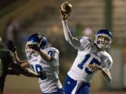 Mountain View's Ryan Hansen throws the ball against Evergreen during Friday's season-opening game at McKenzie Stadium.