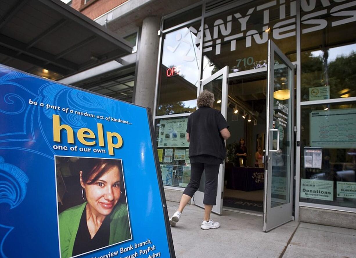 A woman enters the self-defense class and fundraiser for Bethany Storro, 28, who suffered acid burns to her face, at Anytime Fitness in downtown Vancouver on Friday evening.