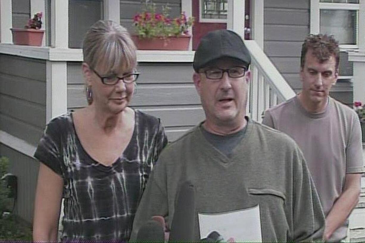 Nancy and Joe Neuwelt speak to the media during a news conference outside their home in Vancouver on Friday afternoon.