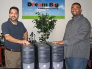 Bagley Downs: Oso Martin, left, from Empower Up, donated three computers to Nathan Webster from the Dream Big Community Center on Sept. 16.