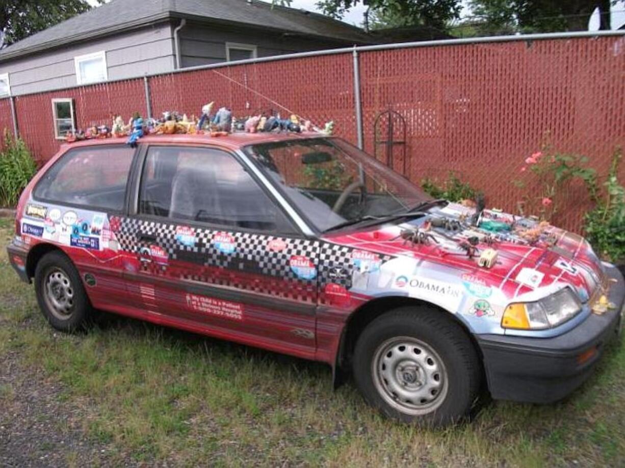 Bennett Huffman's 1989 Honda Civic is adorned with bumper stickers and plastic figurines.