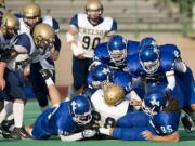 The Mountain View defense stops Kelso ball carrier Slate Miller, #28, at McKenzie Stadium, Friday, October 15, 2010. Mountain View won 28-7.